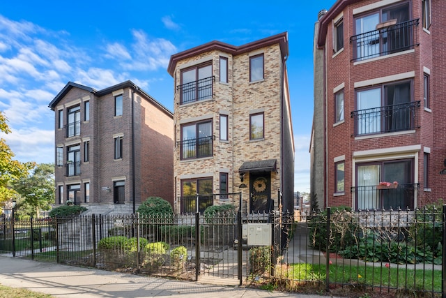 view of front of home featuring a balcony