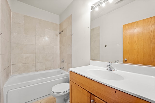 full bathroom featuring vanity, toilet, tile patterned floors, and tiled shower / bath