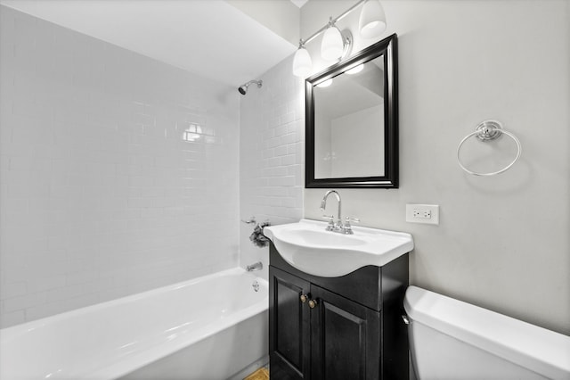 full bathroom with toilet, tiled shower / bath combo, and vanity