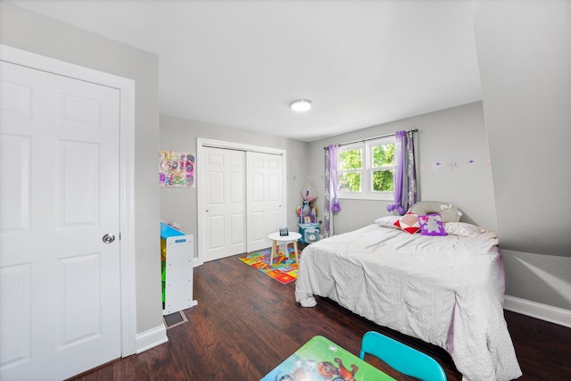 bedroom featuring a closet and dark hardwood / wood-style flooring