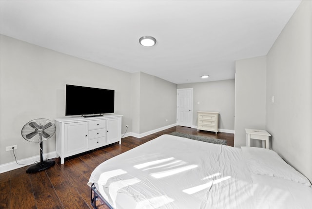 bedroom with dark wood-type flooring