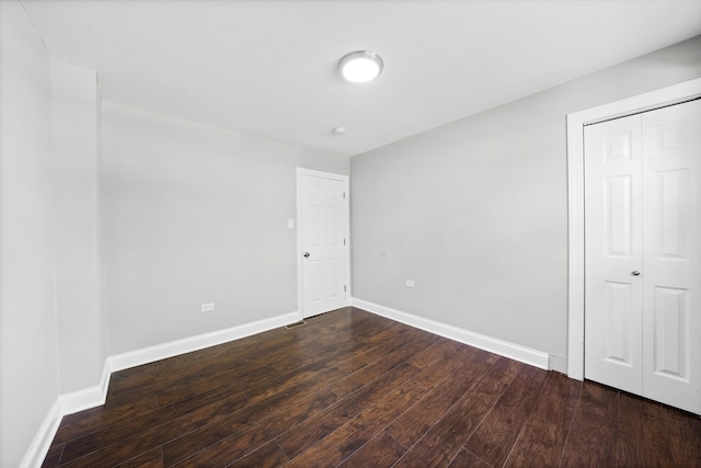 interior space with a closet and dark hardwood / wood-style flooring