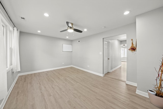 unfurnished room featuring light wood-type flooring and ceiling fan