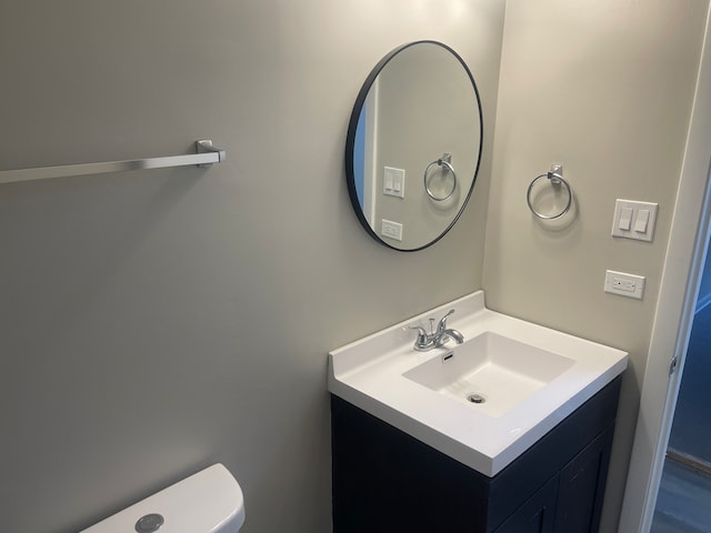 bathroom with vanity and toilet