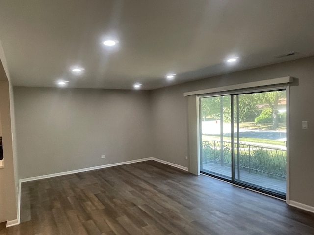 unfurnished room with dark hardwood / wood-style floors