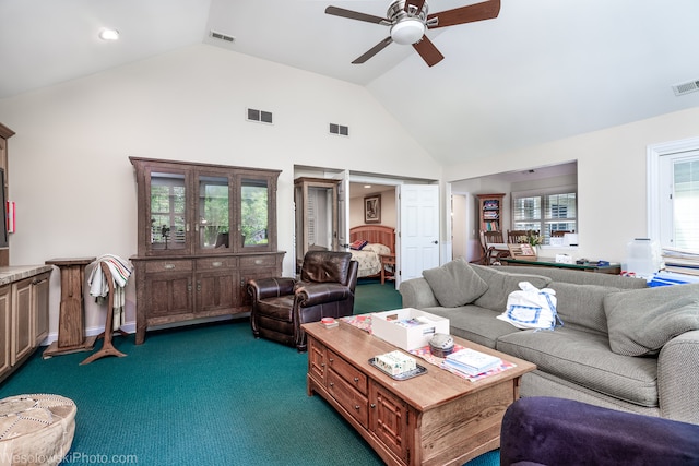 carpeted living room featuring high vaulted ceiling and ceiling fan