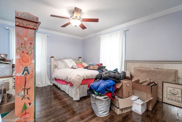 bedroom with dark wood-type flooring, ceiling fan, and crown molding