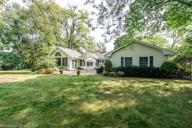 ranch-style home featuring central AC and a front yard