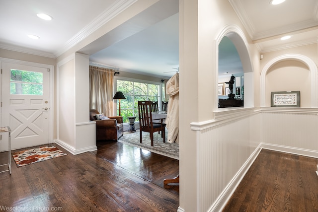 entrance foyer with crown molding, hardwood / wood-style flooring, and a wealth of natural light