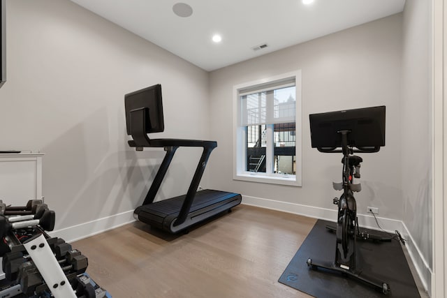 exercise area with wood-type flooring