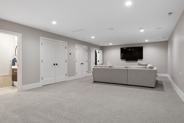 living room featuring light carpet