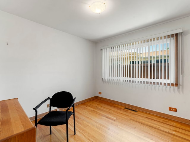 living area featuring hardwood / wood-style floors