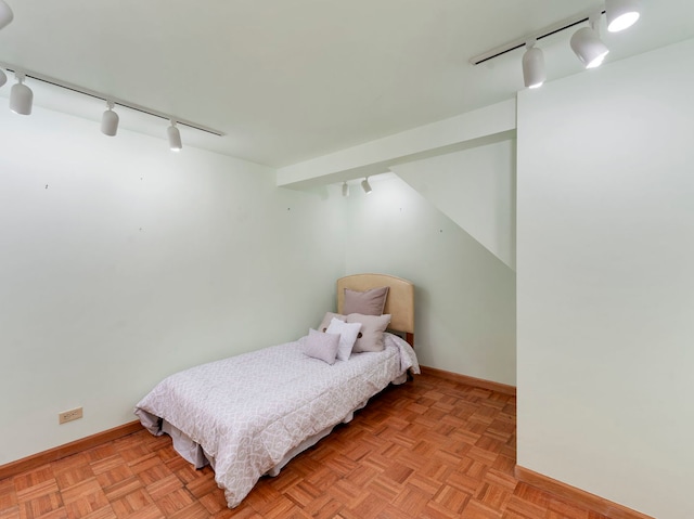 bedroom featuring light parquet floors