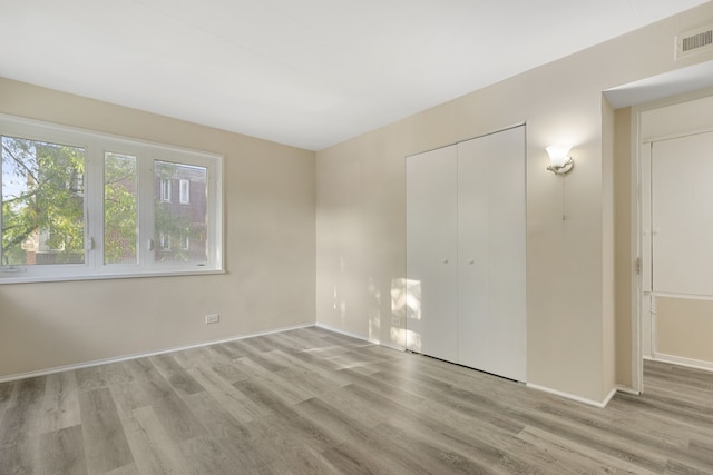 unfurnished room featuring light wood-type flooring