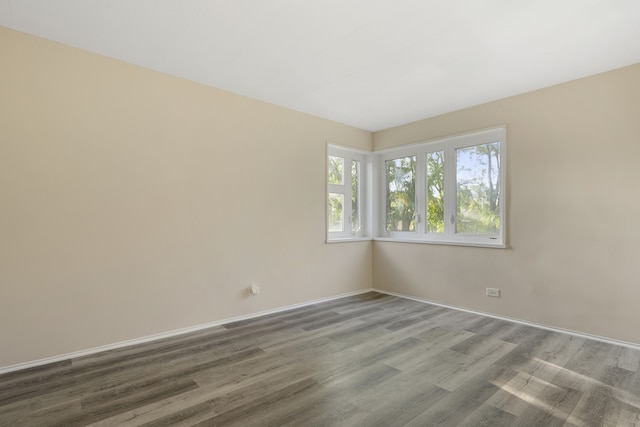 spare room featuring hardwood / wood-style flooring