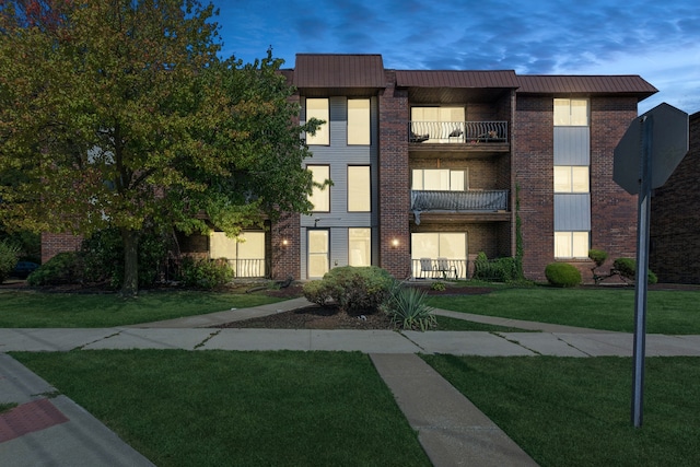 view of outdoor building at dusk