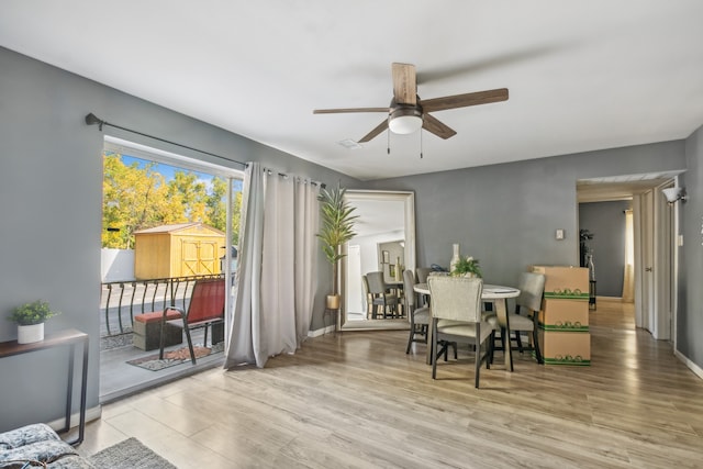 dining room featuring light hardwood / wood-style floors and ceiling fan