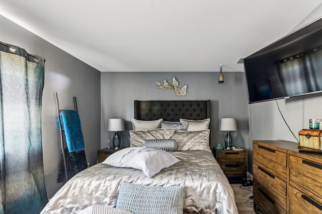 bedroom featuring hardwood / wood-style flooring