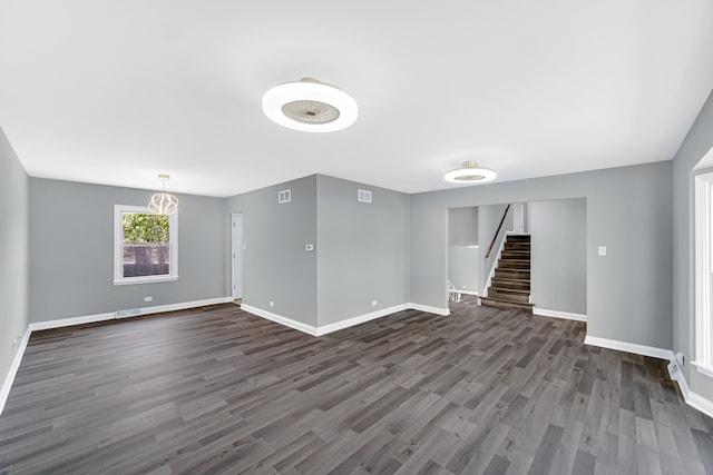 empty room featuring dark wood-type flooring