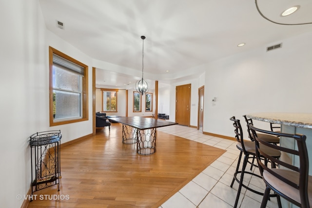 rec room with a chandelier and light wood-type flooring