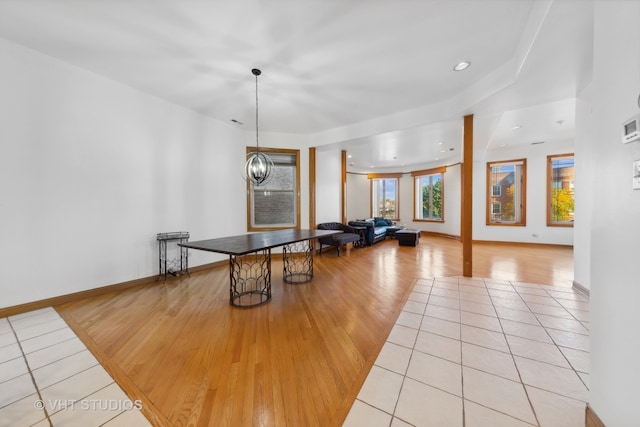 playroom featuring light hardwood / wood-style flooring and a chandelier