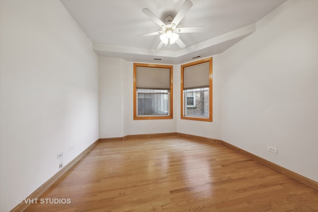 unfurnished room featuring ceiling fan and light wood-type flooring