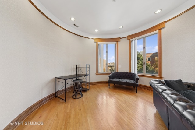 living area with hardwood / wood-style flooring