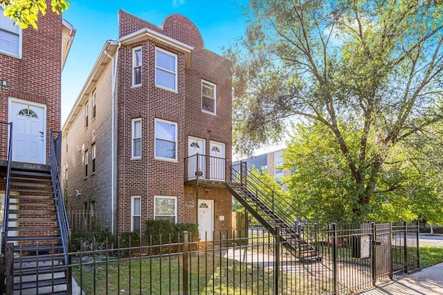 1403 E 71st Pl, Chicago, IL 60619 - view of front of house featuring stairs and brick siding