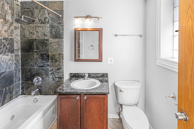 full bathroom featuring tile patterned flooring, tiled shower / bath combo, vanity, and toilet