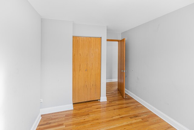 spare room featuring light wood-type flooring