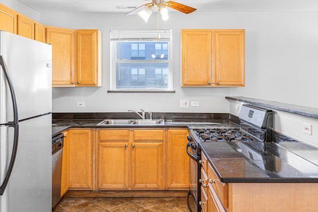 1403 E 71st Pl, Chicago, IL 60619 - kitchen with appliances with stainless steel finishes, a ceiling fan, and dark stone countertops