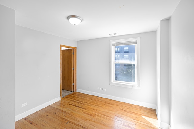 spare room featuring light hardwood / wood-style floors