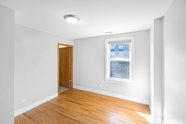 1403 E 71st Pl, Chicago, IL 60619 - empty room with baseboards and hardwood / wood-style flooring