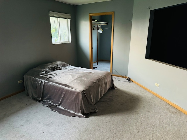 bedroom featuring a closet and carpet flooring