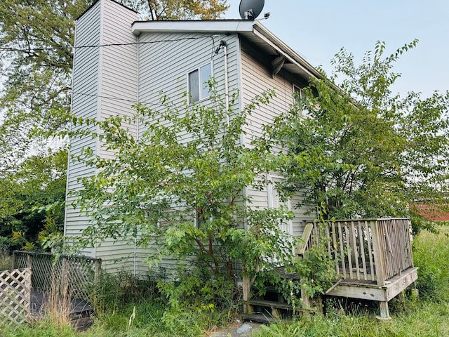 view of side of property with a deck