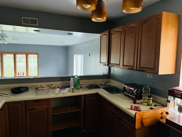 kitchen with ceiling fan and sink