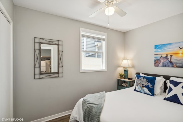 bedroom with ceiling fan, hardwood / wood-style flooring, and a closet