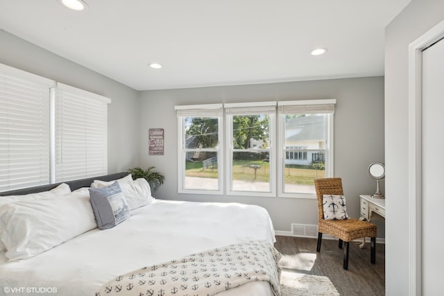 bedroom with hardwood / wood-style floors