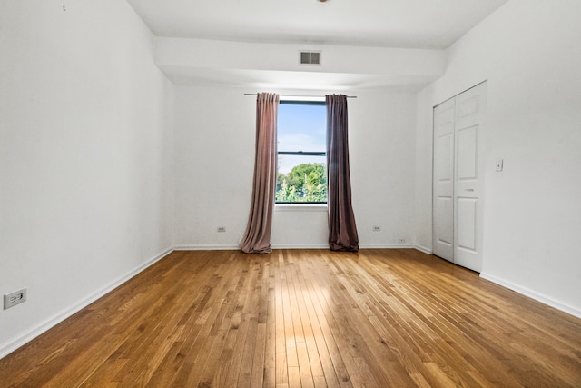 spare room featuring light hardwood / wood-style floors