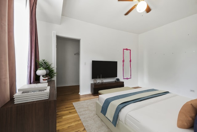 bedroom featuring ceiling fan and wood-type flooring