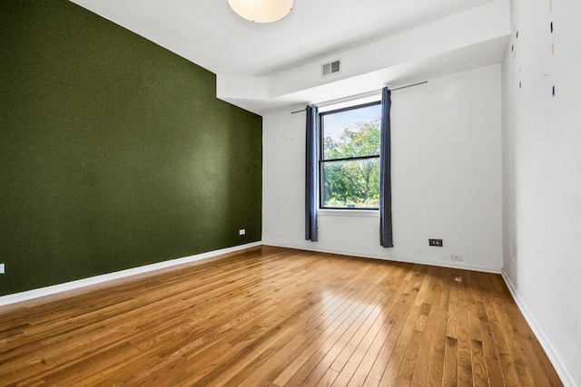 spare room featuring hardwood / wood-style floors