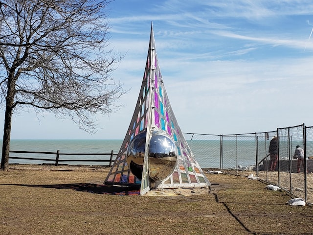 view of jungle gym with a water view