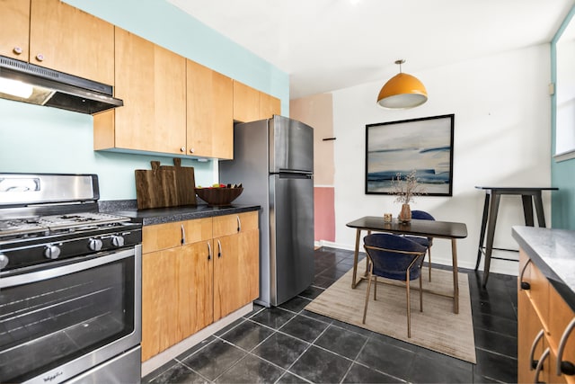 kitchen featuring dark tile patterned flooring and appliances with stainless steel finishes