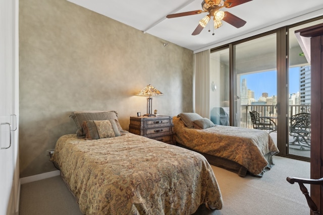 carpeted bedroom with ceiling fan, access to exterior, and expansive windows