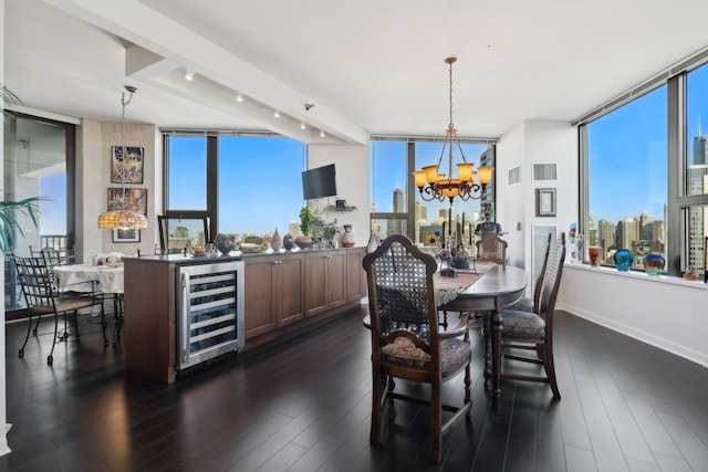 dining area with wine cooler, dark wood-type flooring, a chandelier, and a wealth of natural light