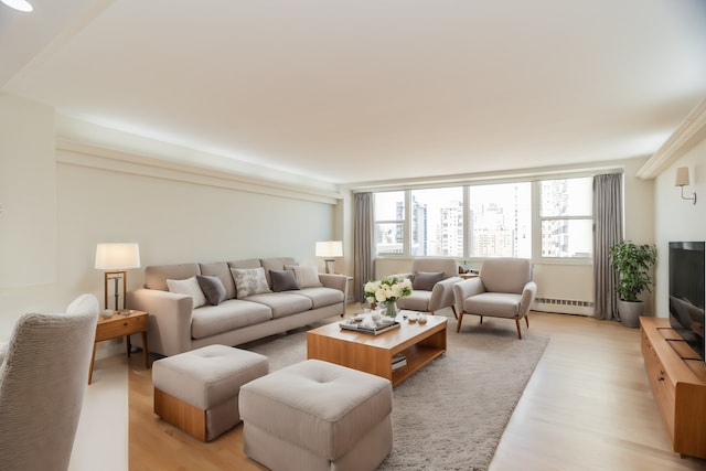 living room featuring light hardwood / wood-style floors and baseboard heating