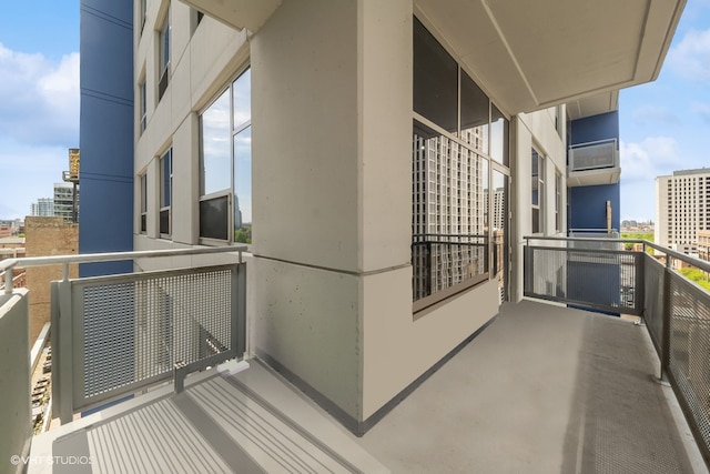 balcony featuring a wall mounted air conditioner