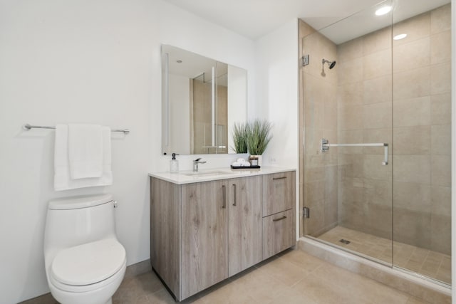 bathroom featuring tile patterned floors, walk in shower, vanity, and toilet