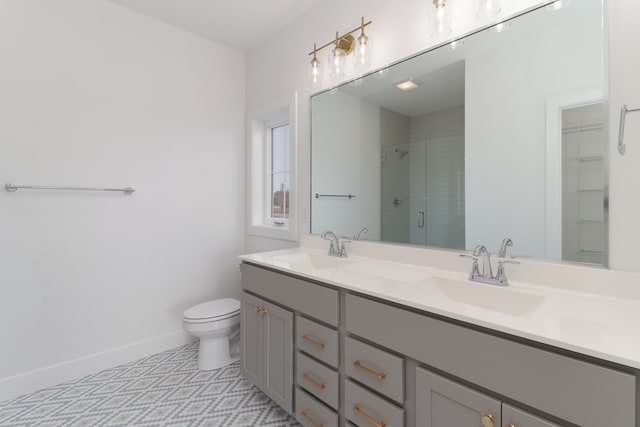 bathroom featuring walk in shower, toilet, and vanity