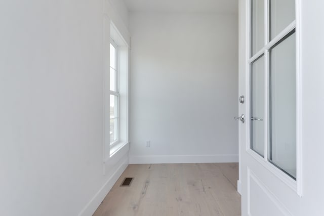 unfurnished room featuring light hardwood / wood-style flooring